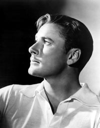 Errol Flynn 1930s photo print showcasing classic Hollywood charm.