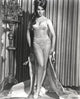 Ann-Margaret wearing lingerie and removing her coat, classic Hollywood photo print.