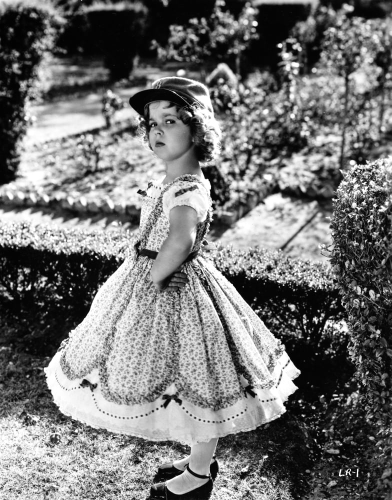 Shirley Temple posed in cap photo print.