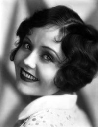 Classic photo print of Nancy Carroll smiling, vintage Hollywood portrait.
