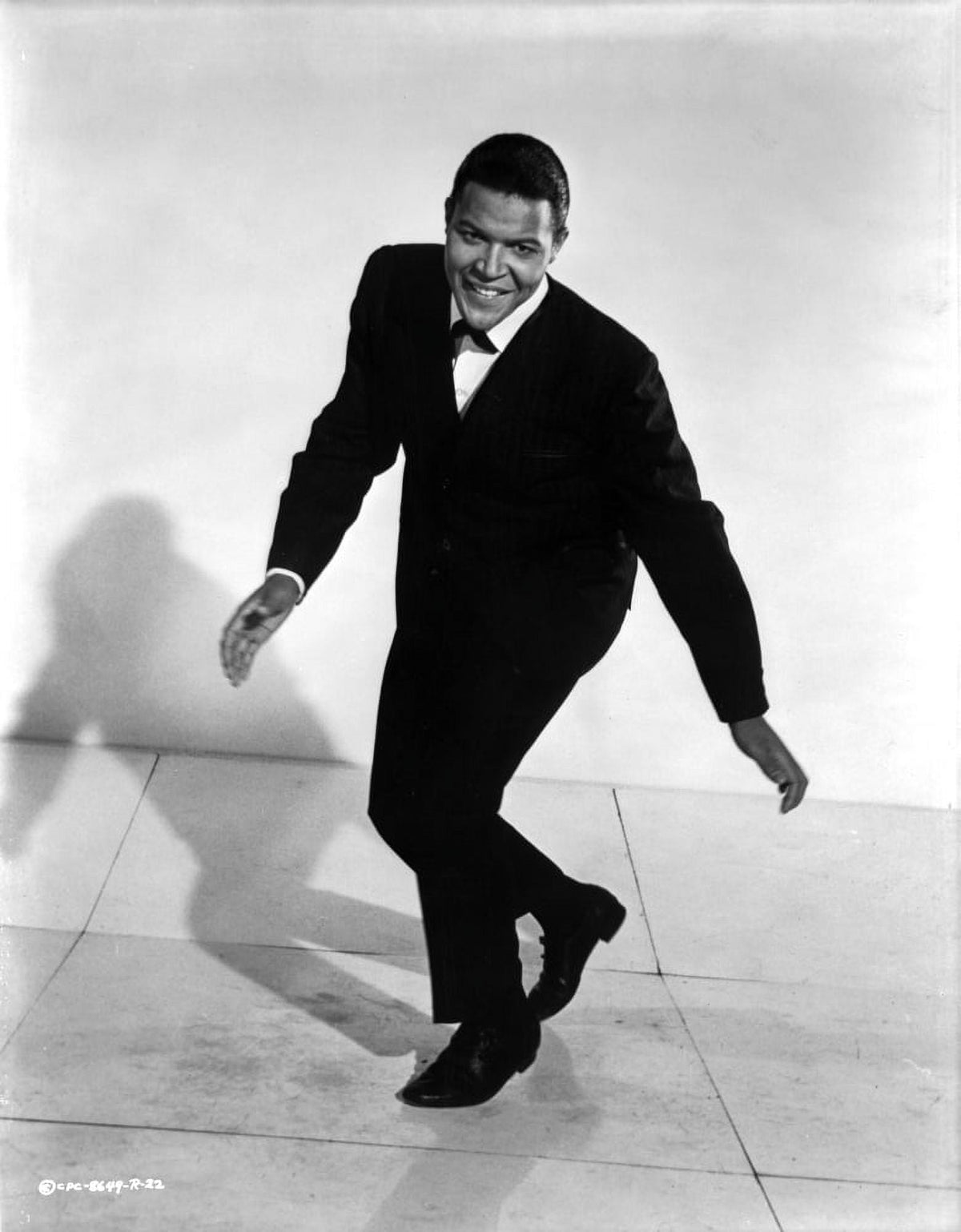 Chubby Checker dancing photo print showcasing the iconic artist in motion.