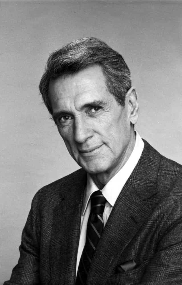 Rock Hudson posed in a black suit photo print, classic Hollywood style.