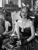 Bette Davis photo print in black strapless gown with crossed hands.