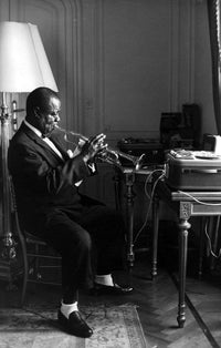 Louis Armstrong playing trumpet photo print - available in various sizes.