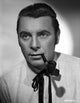 Photo print of George Brent smoking a pipe, classic actor portrait.