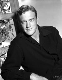 James Arness sitting in front of a window photo print.