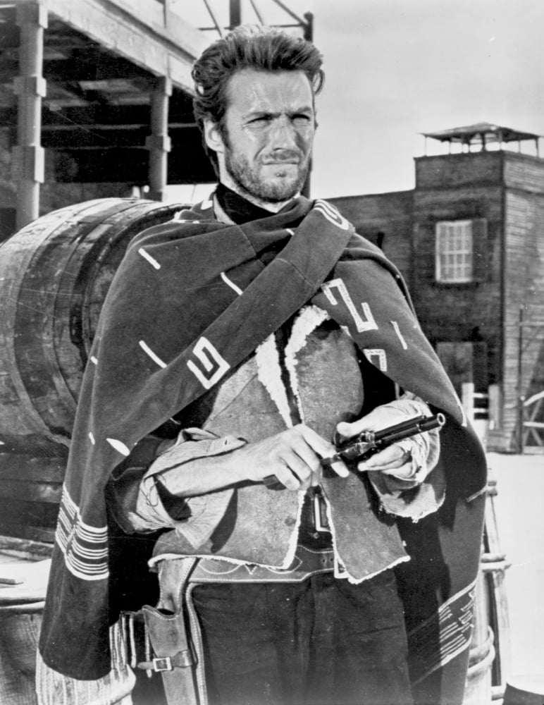 Clint Eastwood holding a pistol in a printed coat photo print
