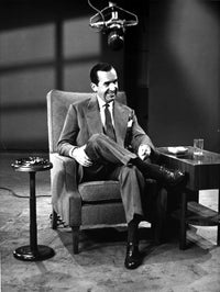 Edward R Murrow seated in an armchair photo print