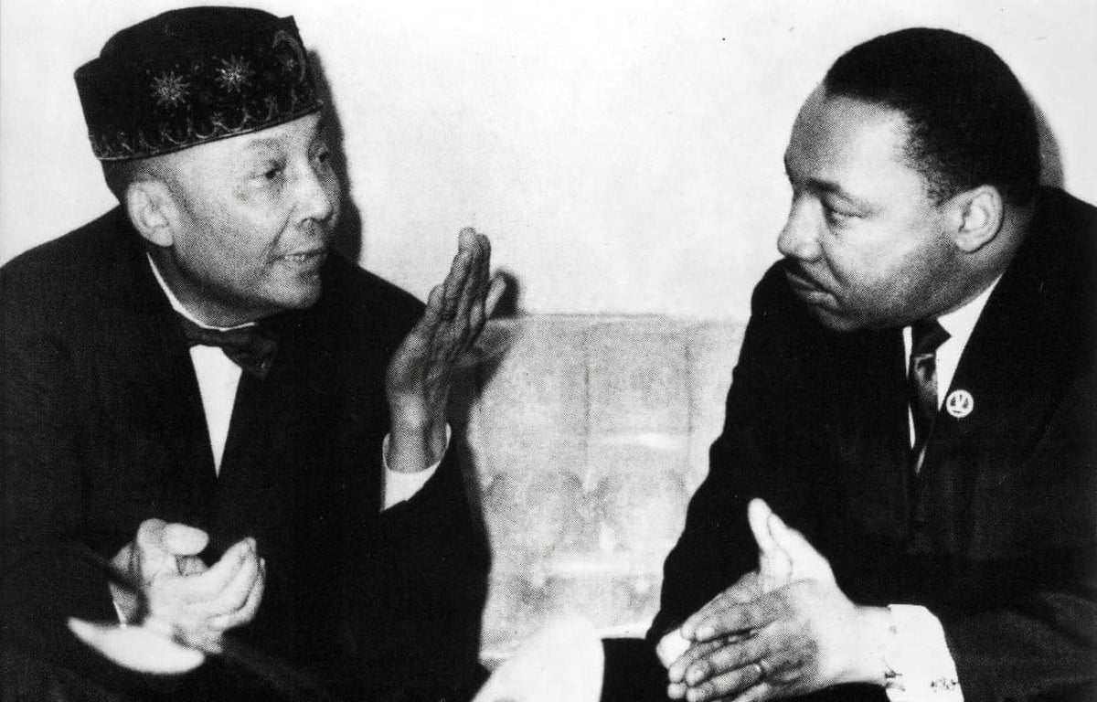 Martin Luther King Jr. speaking with Elijah Muhammad photo print
