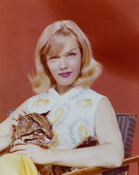 Anne Francis portrait photo print with baby leopard on red background.