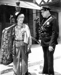 Marx Brothers comedy scene photo print featuring a man talking to a police officer.