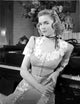 Dorothy McGuire posed in an embroidered dress photo print.