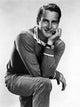 Vintage photo print of Paul Newman from the 1950s, showcasing classic Hollywood charm.