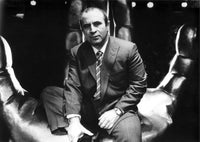 Bob Hoskins wearing a suit in a hand sculpture photo print.