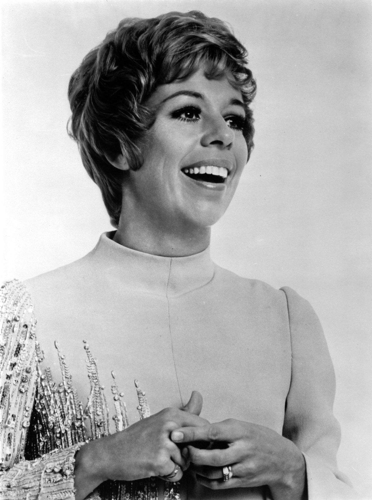 Carol Burnett wearing an embroidered long sleeve dress photo print