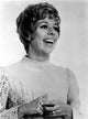 Carol Burnett wearing an embroidered long sleeve dress photo print