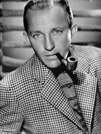 Bing Crosby posed in checkered suit with pipe photo print
