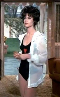 Elizabeth Montgomery photo print in black one-piece with heart and white shirt.