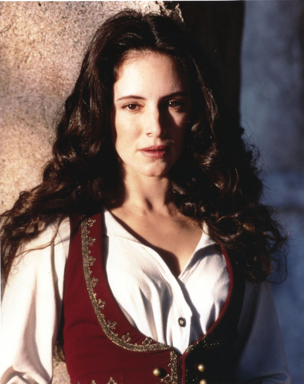 Madeleine Stowe elegant photo print in white dress with red vest.
