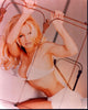 Pamela Anderson holding a metal bed frame photo print
