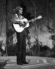 John Denver performing photo print capturing a classic music moment.