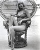 Stella Stevens seated on royal chair in black and white photo print