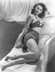 Ava Gardner lounging by the pool photo print available in multiple sizes.