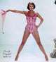 Cyd Charisse throwing pink scarf photo print, capturing elegance and charm.