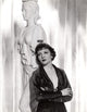 Claudette Colbert 1935 portrait leaning against Greek statue photo poster print.