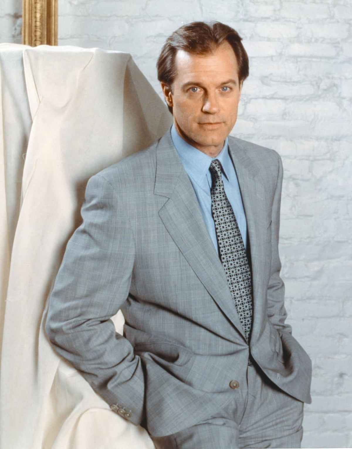 Stephen Collins posed in a gray tuxedo photo print