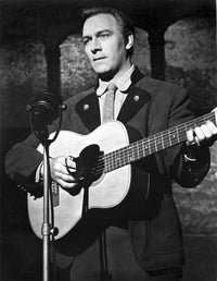 Christopher Plummer playing guitar on stage photo print