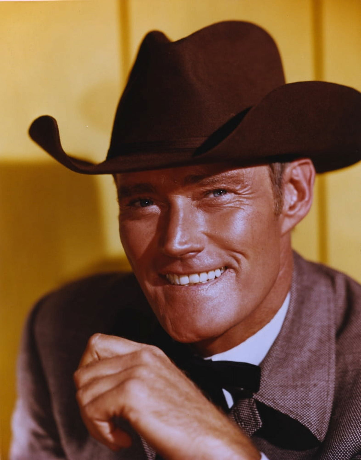 Chuck Connors smiling in a suit and hat photo print