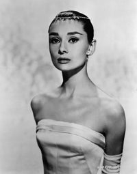 Audrey Hepburn posed elegantly in a white dress photo print.