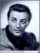 Robert Mitchum 1946 photo print showcasing classic Hollywood charm.