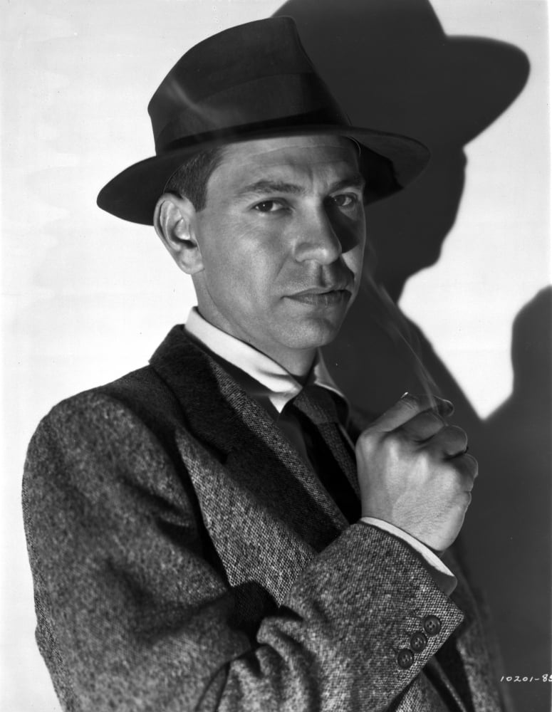 Jack Webb photo print posed in suite with white background.