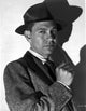Jack Webb photo print posed in suite with white background.