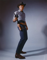 Chuck Connors cowboy photo print in classic outfit with pistol.