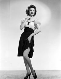 Peggy Ryan posed photo print wearing blouse and black skirt