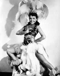 Elegant portrait of Lena Horne wearing a white sheer silk garment.