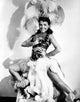 Elegant portrait of Lena Horne wearing a white sheer silk garment.