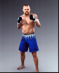 Chuck Liddell action photo print in blue shorts.