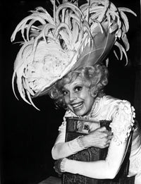 Carol Channing wearing a feathered hat photo print.