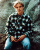 Devon Sawa sitting on rock in plaid shirt photo print