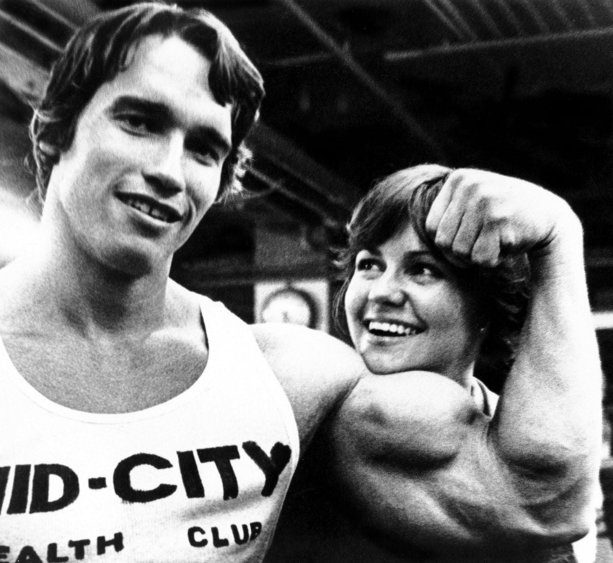 Stay Hungry movie poster print featuring Arnold Schwarzenegger and Sally Field.
