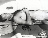Sean Connery sunbathing on a boat photo print.
