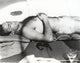 Sean Connery sunbathing on a boat photo print.