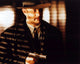 Tom Hanks holding gun on set of Road to Perdition photo print.