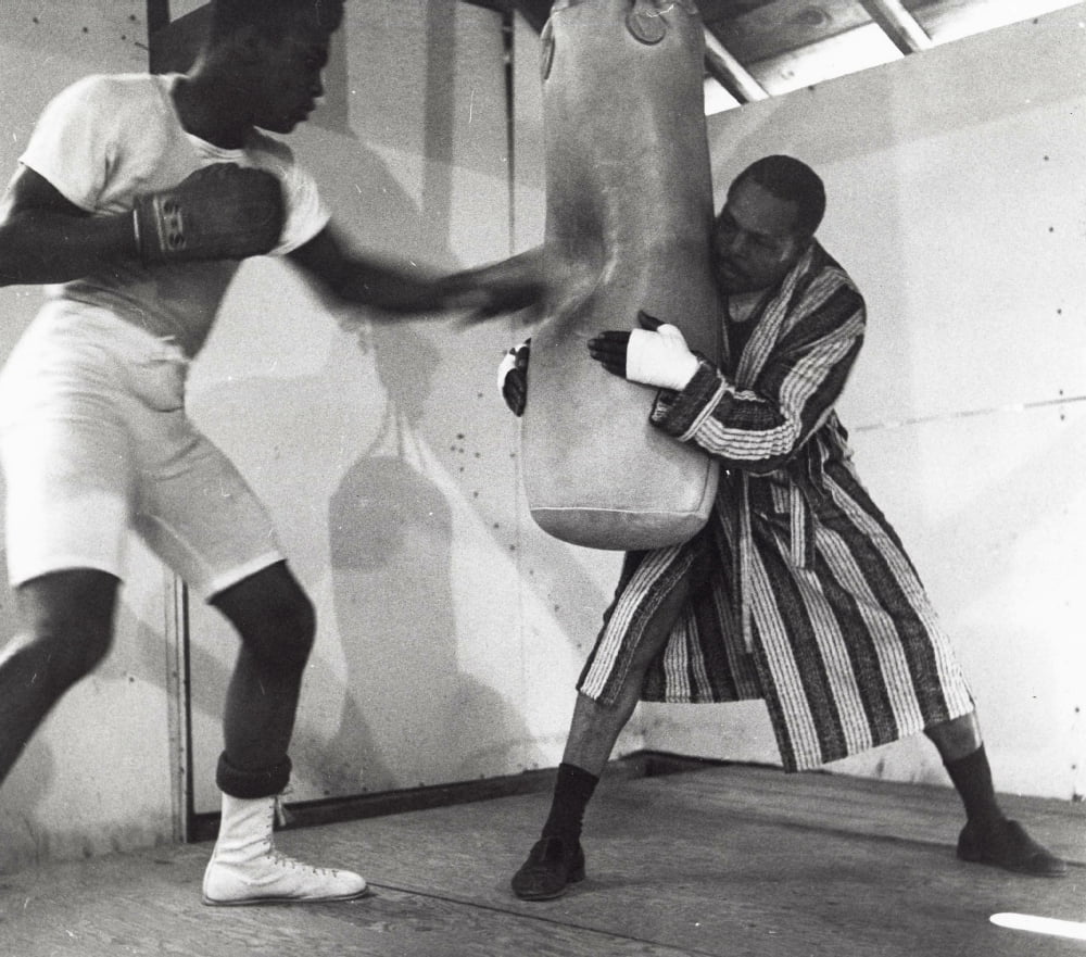 Muhammad Ali training with a boxing bag photo print