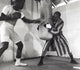Muhammad Ali training with a boxing bag photo print