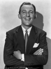 Bing Crosby smiling in tuxedo photo print on white background.